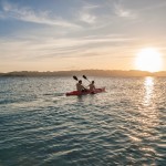 Chase the sunset as you kayak your way through aquamarine waters